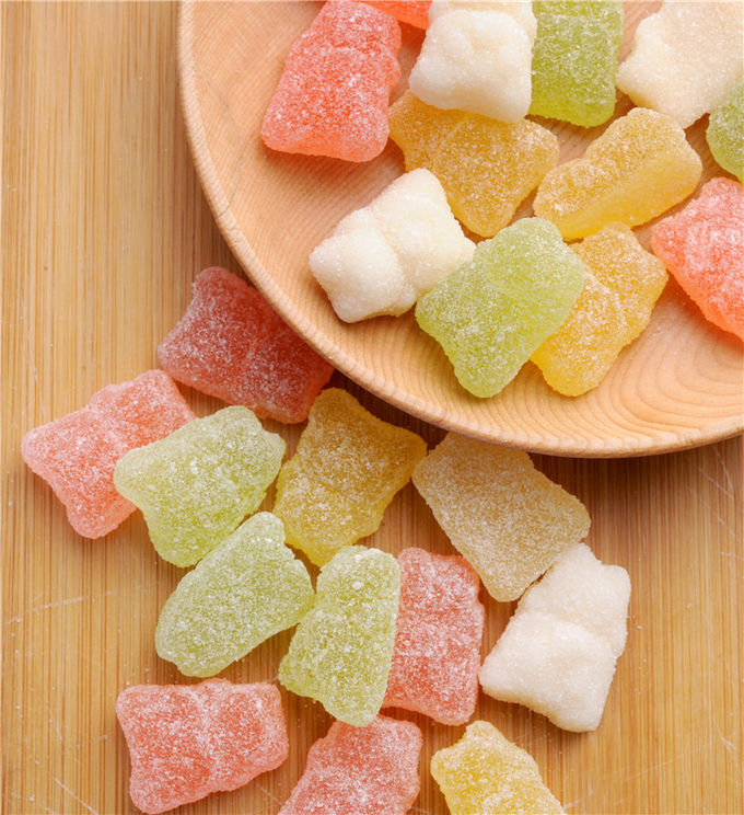 Multivitaminico vegetariano Gummies della glassa dello zucchero con la borsa avvolta individuo