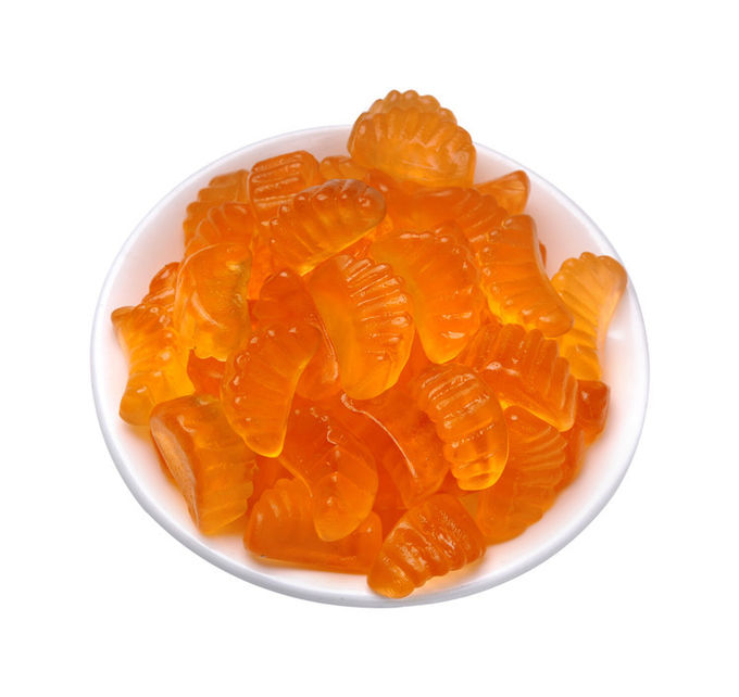 Il sapore arancio scherza i dolci gommosi del vegano halal a forma di frutta gommosa delle vitamine